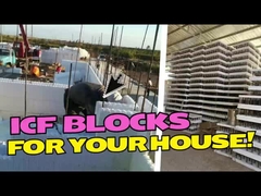 Modern görünümlü çatı ve dış duvar ve bir arabanın bulunduğu çift katlı bir apartman binası.